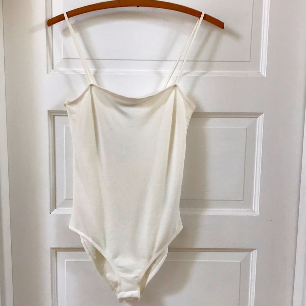 New with tags TOPSHOP Sz 8 body suit. Spaghetti straps warm white snap crotch
